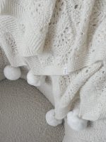 Hand Knitted Cream Alpaca Baby Blanket – Fur Pom Poms - Image 2